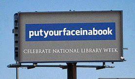 National Library Week put your face in a book billboard